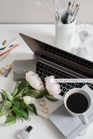 Coffee, Peonies and Laptop on Workspace. Stock Image