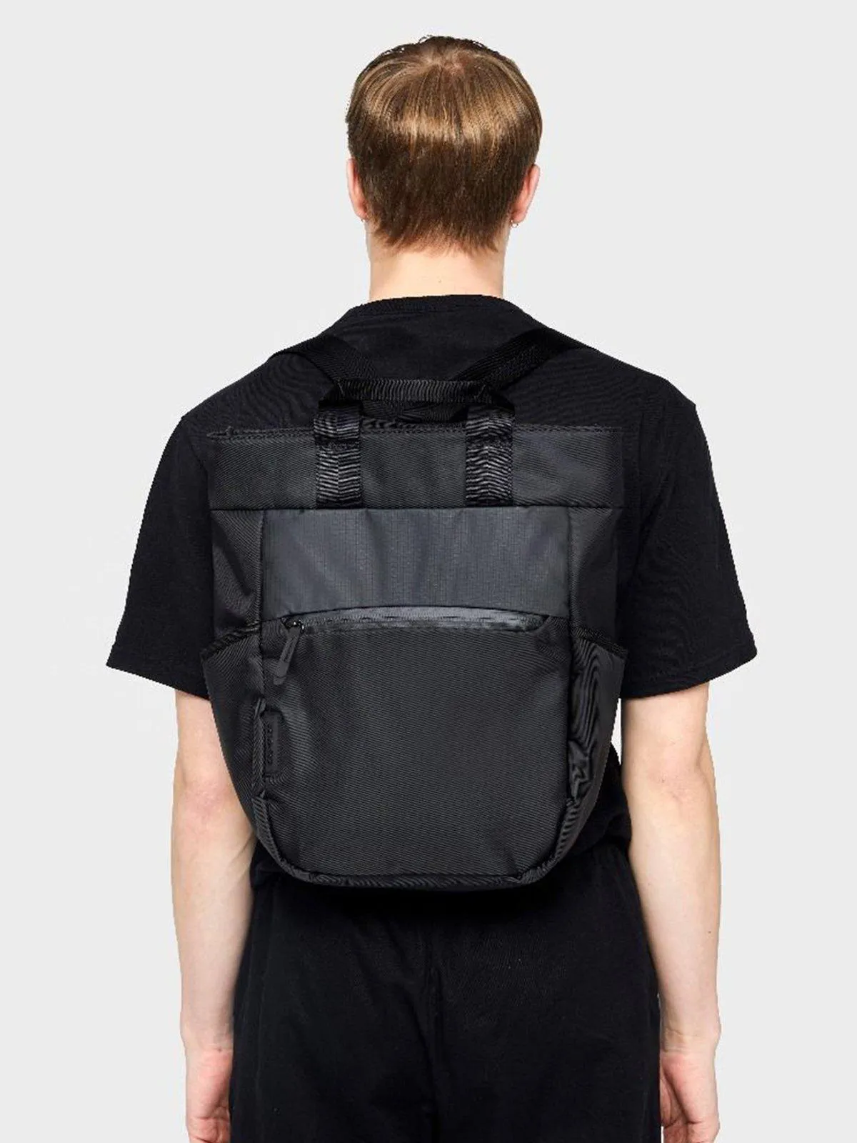 Crumpler Art Collective Medium Cross Body Backpack Black