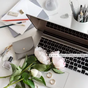 Peonies and Laptop on Workspace. Stock Image