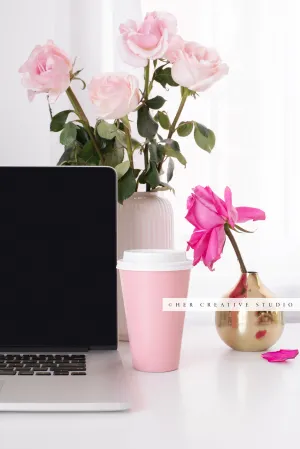 Pink Roses and coffee on Workspace. Stock Photo